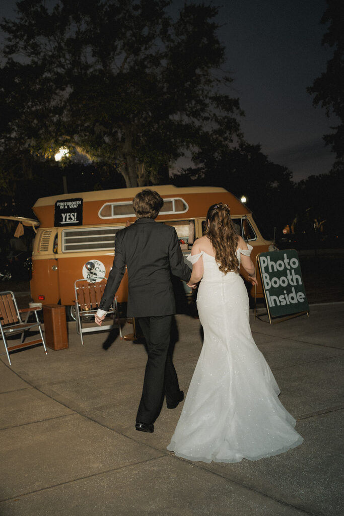 Couple portrait with vintage Volkswagen bus photo booth