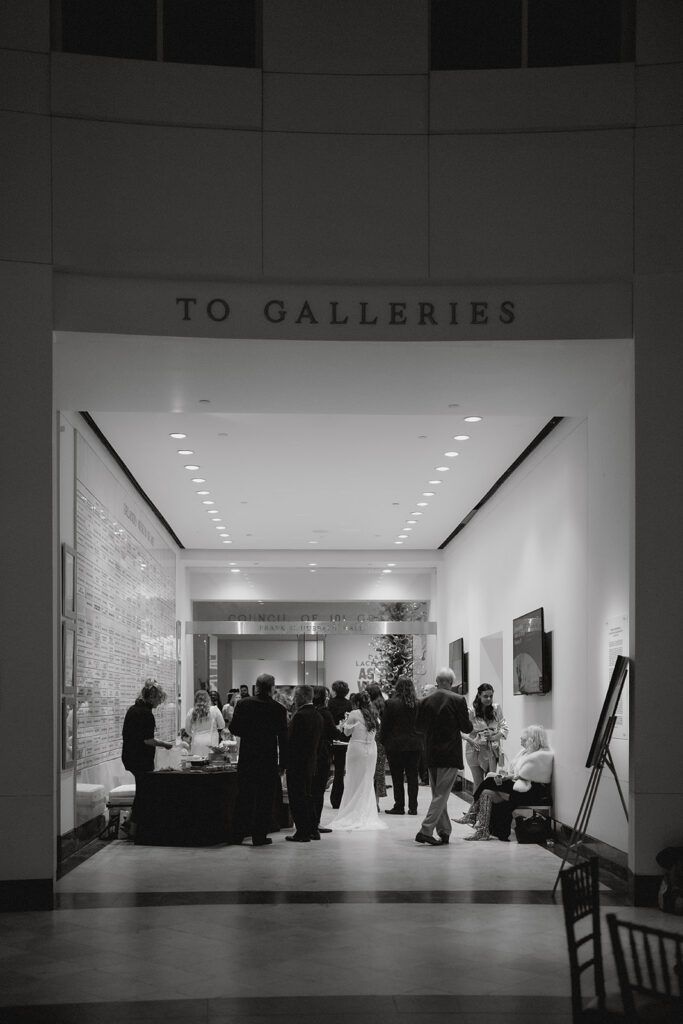wide shot of cocktail hour inside an art museum