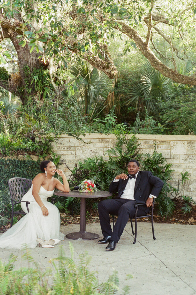 Couple seated by the café at Bok Tower Gardens, Central Florida elopement photography